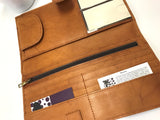 The Rochester cowhide travel clutch - tan