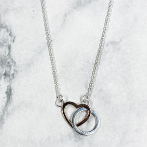 Joined heart and circle pendant