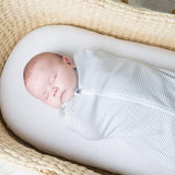 The Living Textiles luxuriously soft 100% cotton jersey swaddles make swaddling a breeze. Featuring a hip healthy design and 2-way zip so you can change baby without waking them. Swaddling can be a great way to keep baby from being disturbed by their own startle reflex and make them feel warm and secure as if they were cocooned in the womb. 
